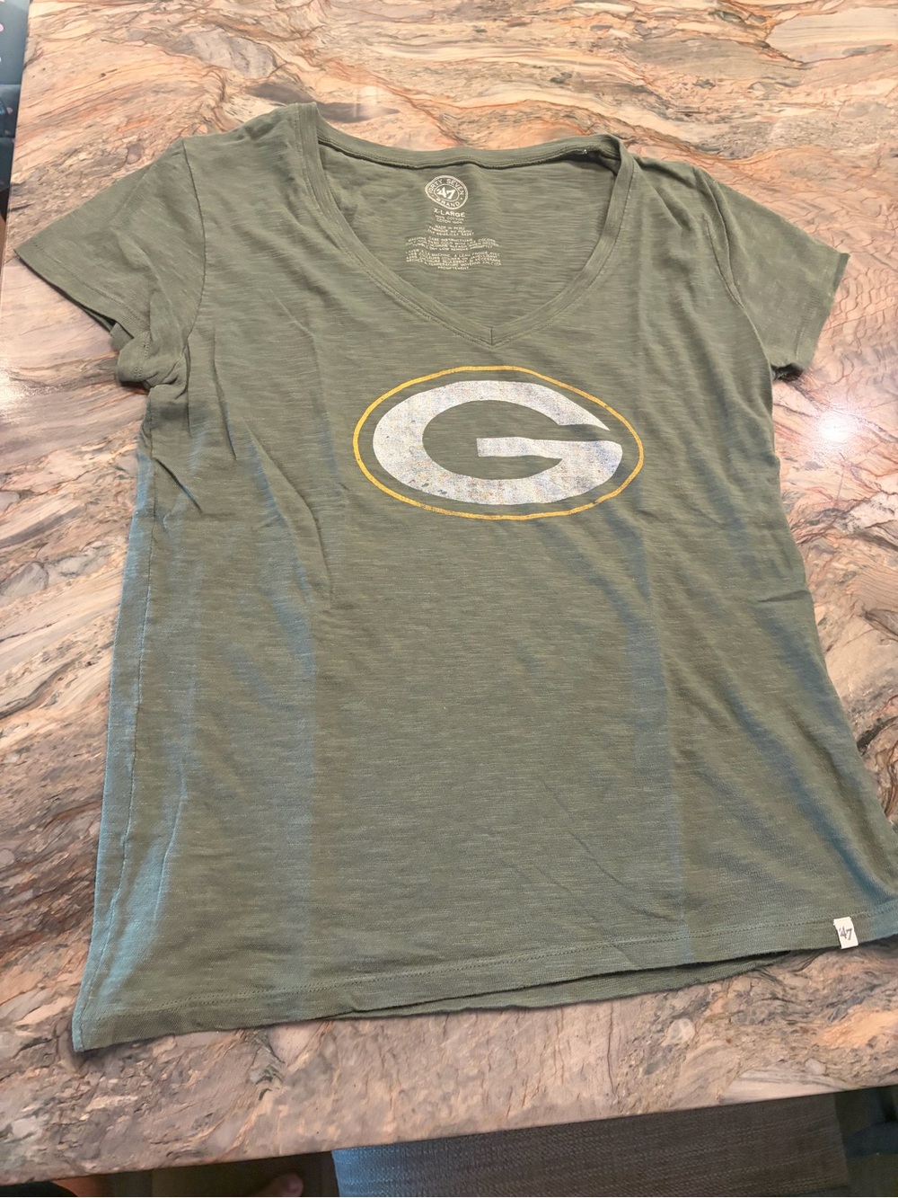 47 Green V-Neck Women's Top with Graphic Emblem